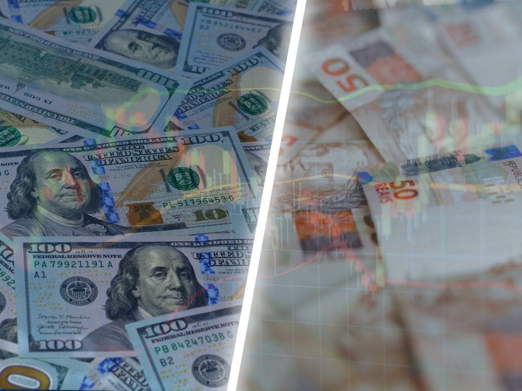 Cédulas de dólar e real lado a lado com gráficos de mercado ao fundo, representando o impacto do Fed na economia brasileira.